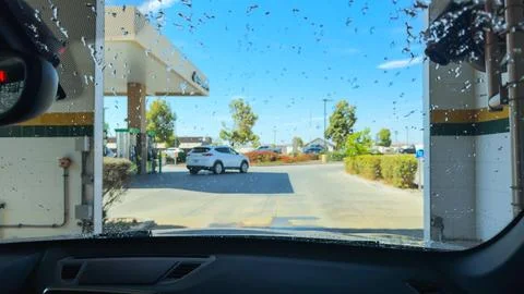 View through a wet windshield exiting a car wash. Stock Photos