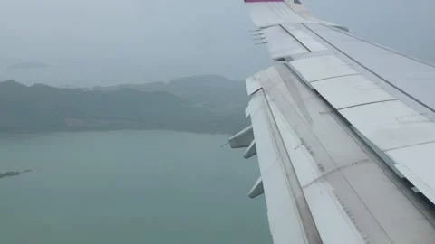 View through window of airplane while flying in sky from inside aeroplane c.. 動画素材 281835300
