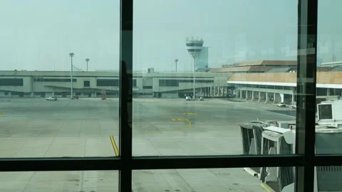 View through window of the airport terminal in daytime to the airplane park.. Stock Footage 236119167
