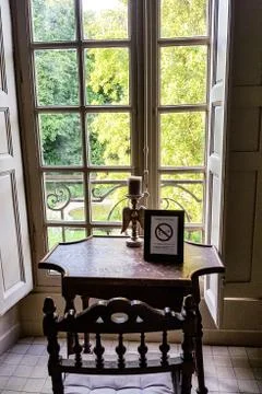 View through the window with bars on the green Park Stock Photos