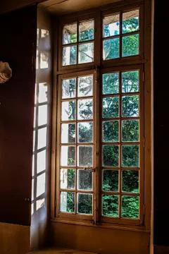 View through the window with bars on the green Park Stock Photos