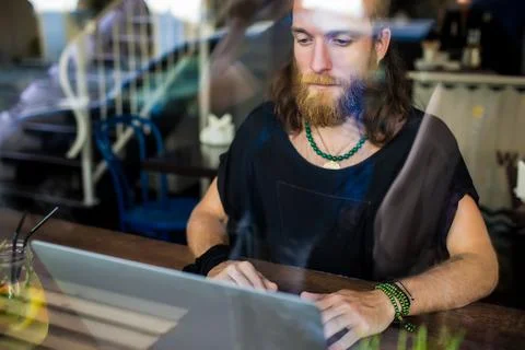 View through the window of a bearded Sweden hipster guy professional content  Stock Photos