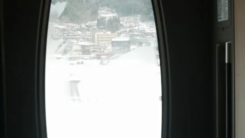 View through window on dtrain's door outside bullet highspeed train while t.. Stock Footage 336472891