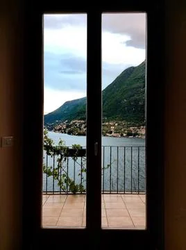 View through the window frame from the room on Lake Como Stock Photos