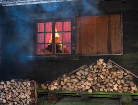 View through the window with glazing bars of a log cabin Stock Photos