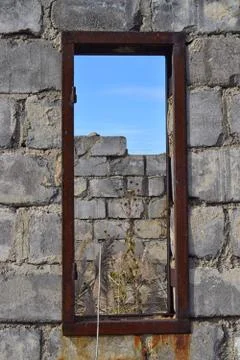 View through window hole of brick building concrete Stock Photos