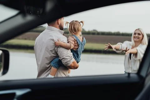 View Through Window Inside of Car, Happy Young Family with Kid Together Enjoying Stock Photos
