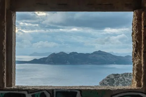 A view through a window on a mountain formation on Majorca, spain Stock Photos