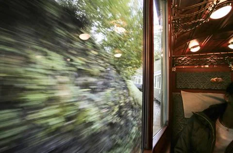 View through window from moving passenger train Foto stock