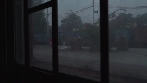 View through the window of a moving train in India - leaving station Stock Footage 114660111