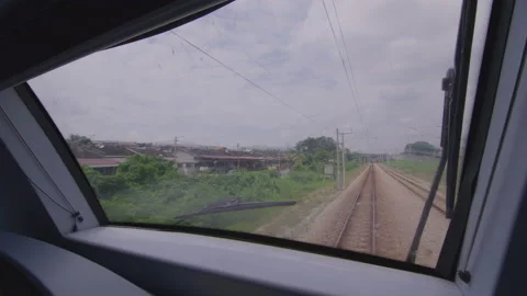 The view through the window of a moving train, Malaysia Stock Footage 134674470
