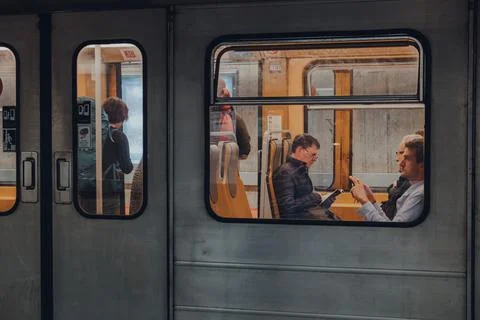 View through window of people inside Brussels Metro carriage, Belgium. Stock Photos