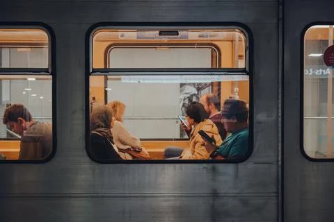 View through window of people inside Brussels Metro carriage, Belgium. Stock Photos