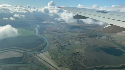 View through the window of the plane to a beautiful area. Stock Footage 163585202