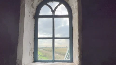 View through window of spinning windmill wings, blades. Kinderdijk, Netherlands Video stock 219257411