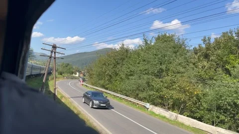 View through the window of the tail of the train at the turn Stock Footage 250995444