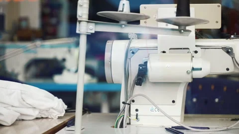 View through the window of tailor's workshop, old professional sewing machine Stock Footage 250019169