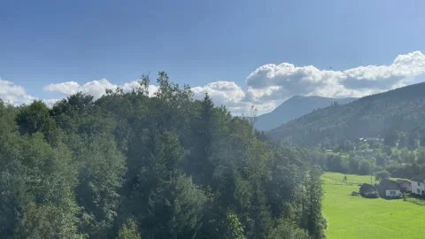 View through the window of the train to the mountain nature Stock Footage 250837874