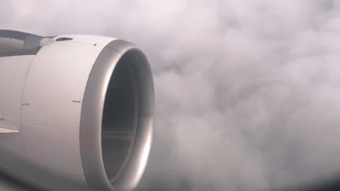 View through window at turbine plane against clouds risk of accident during Stock Footage 98177276