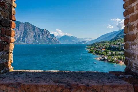 View through window on windsurfers on Lake Garda near Malcesine in Italy. Stock Photos
