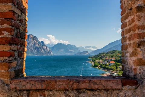 View through window on windsurfers on Lake Garda near Malcesine in Italy. Stock Photos