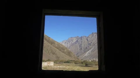 View through a window to a wonderful green mountain landscape on vacation 库存影片 190748532