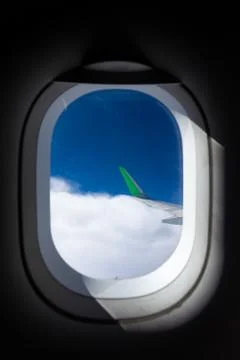 View through the windows of an airplane, view of the clouds, wing. Fotos Stock