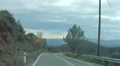 View through windscreen of car taking dangerous sharp turns on mountain road 4k or 4k+ Resolution