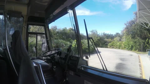 View through the windscreen of a parked bus of the road ahead Stock Footage 153648145