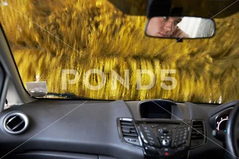 View Through Windshield In Automated Car Wash Stock Photos