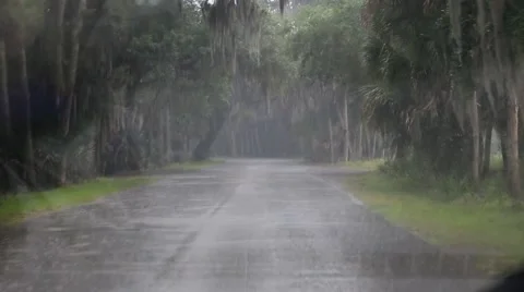 A view through the windshield of a car driving in rain Stock Footage 49043108