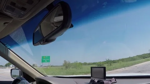 A view through the windshield of a car driving down the highway Stock Footage 78253886
