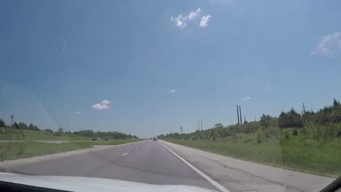 A view through the windshield of a car driving down the highway Stock Footage 78254109