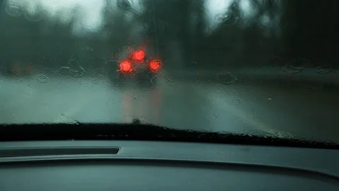 View through the windshield of a car driving on the road in the rain. Stock Footage 101308525
