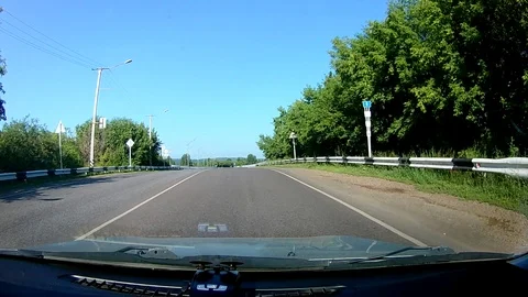 A view through the windshield of a car driving down the highway. Stock Footage 111960456