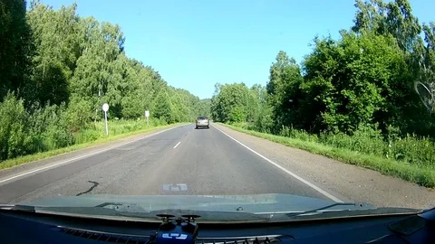 A view through the windshield of a car driving down the highway. Stock Footage 111960545