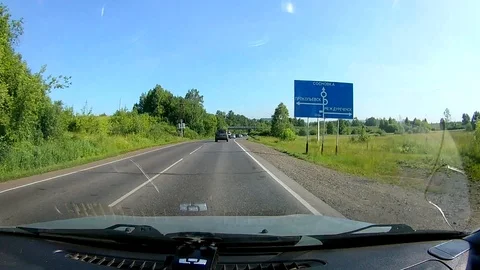 A view through the windshield of a car driving down the highway. Stock Footage 111960583