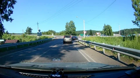 A view through the windshield of a car driving down the highway. Stock Footage 111960613