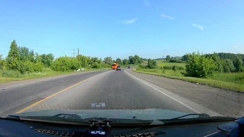 A view through the windshield of a car driving down the highway. Stock Footage 111960671