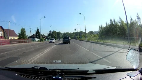 A view through the windshield of a car driving down the highway. Stock Footage 111960738