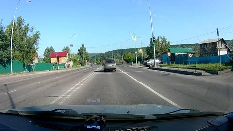 A view through the windshield of a car driving down the highway. Stock Footage 111960740