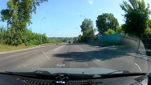 A view through the windshield of a car driving down the highway. Stock Footage 111960781