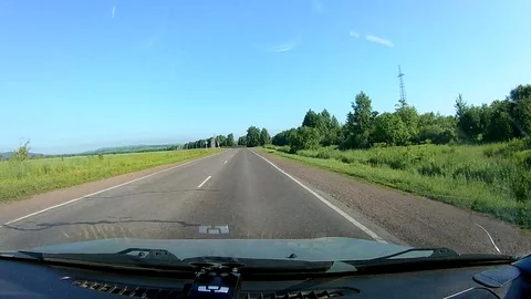 A view through the windshield of a car driving down the highway. Stock Footage 111960841