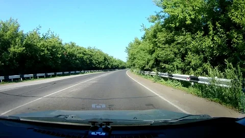 A view through the windshield of a car driving down the highway. Stock Footage 111960862