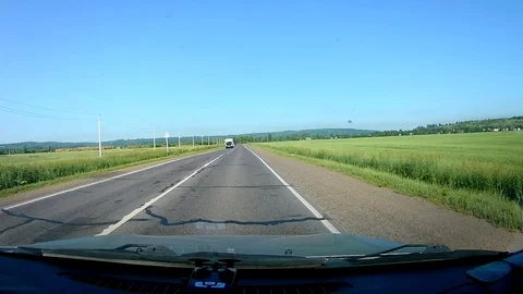 A view through the windshield of a car driving down the highway. Stock Footage 111960888