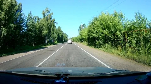 A view through the windshield of a car driving down the highway. Stock Footage 111960973