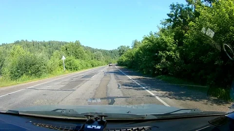 A view through the windshield of a car driving down the highway. Stock Footage 111960974