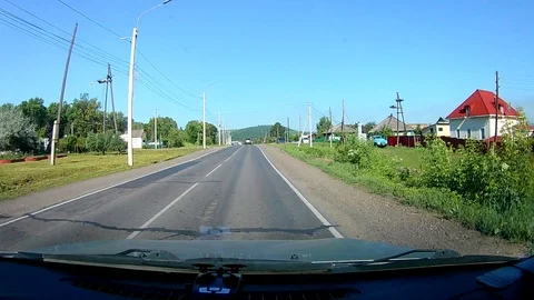 A view through the windshield of a car driving down the highway. Stock Footage 111961039