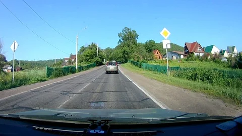 A view through the windshield of a car driving down the highway. Stock Footage 111961088