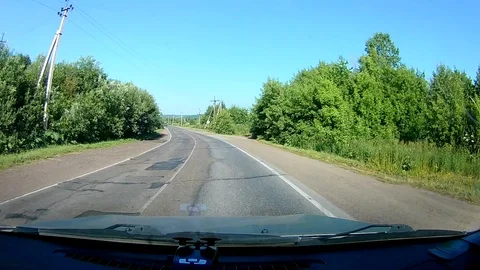 A view through the windshield of a car driving down the highway. Stock Footage 111961090